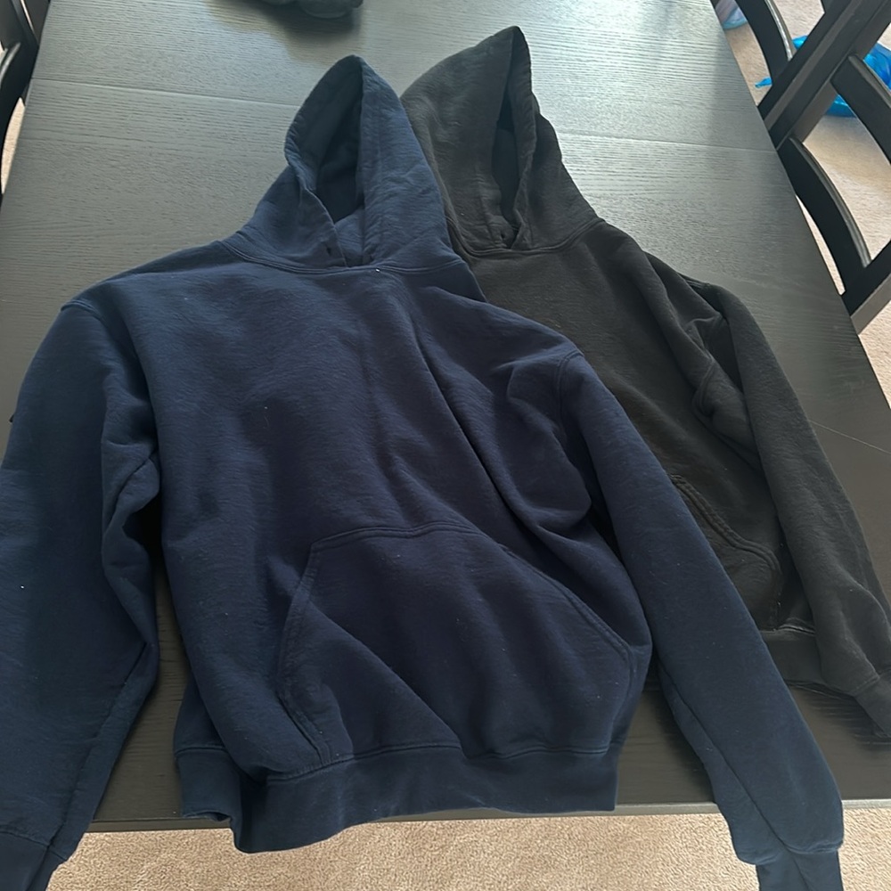 Two women’s hoodies navy and black size small.
